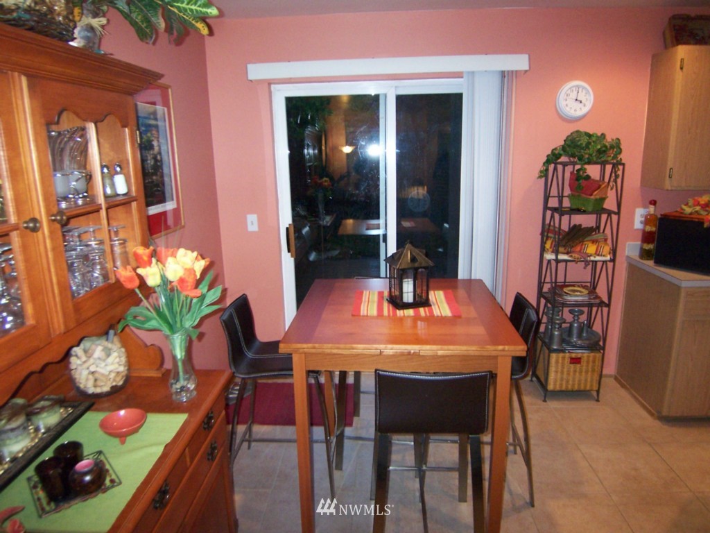 10624 Northeast 175th Street Bothell, WA 98011 - Photo 4 of 17 a dining room with furniture and wooden floor