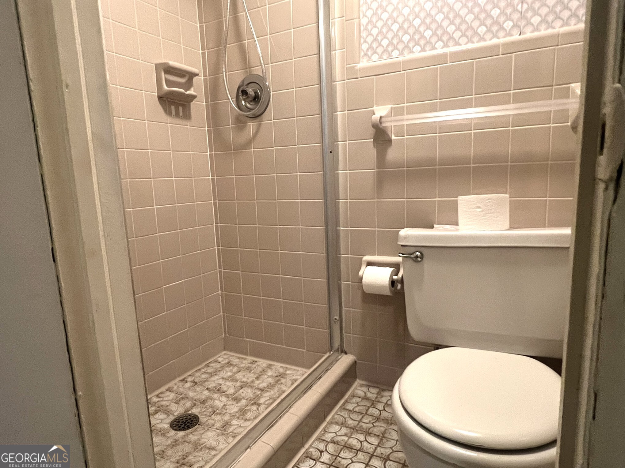 3640 South Walden Road Macon, GA 31216 - Photo 16 of 21 a bathroom with a toilet and a shower