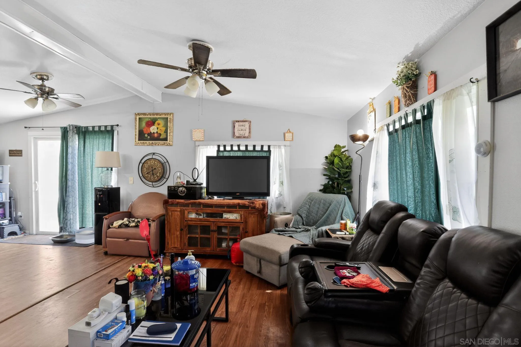 16522 Stagecoach Road Corning, CA 96021 - Photo 8 of 30 a living room with furniture a flat screen tv and a window