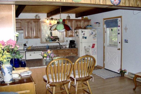 929 Decker Road Bushkill, PA 18324 - Photo 3 of 8 a view of a dining room with furniture and chandelier
