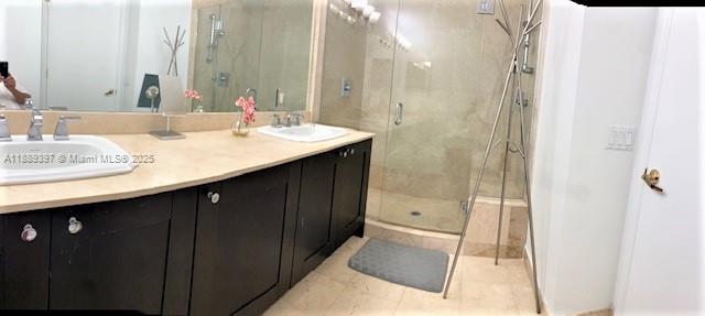 4100 Salzedo Street, Unit 702 Coral Gables, FL 33146 - Photo 13 of 15 a bathroom with a sink and a mirror