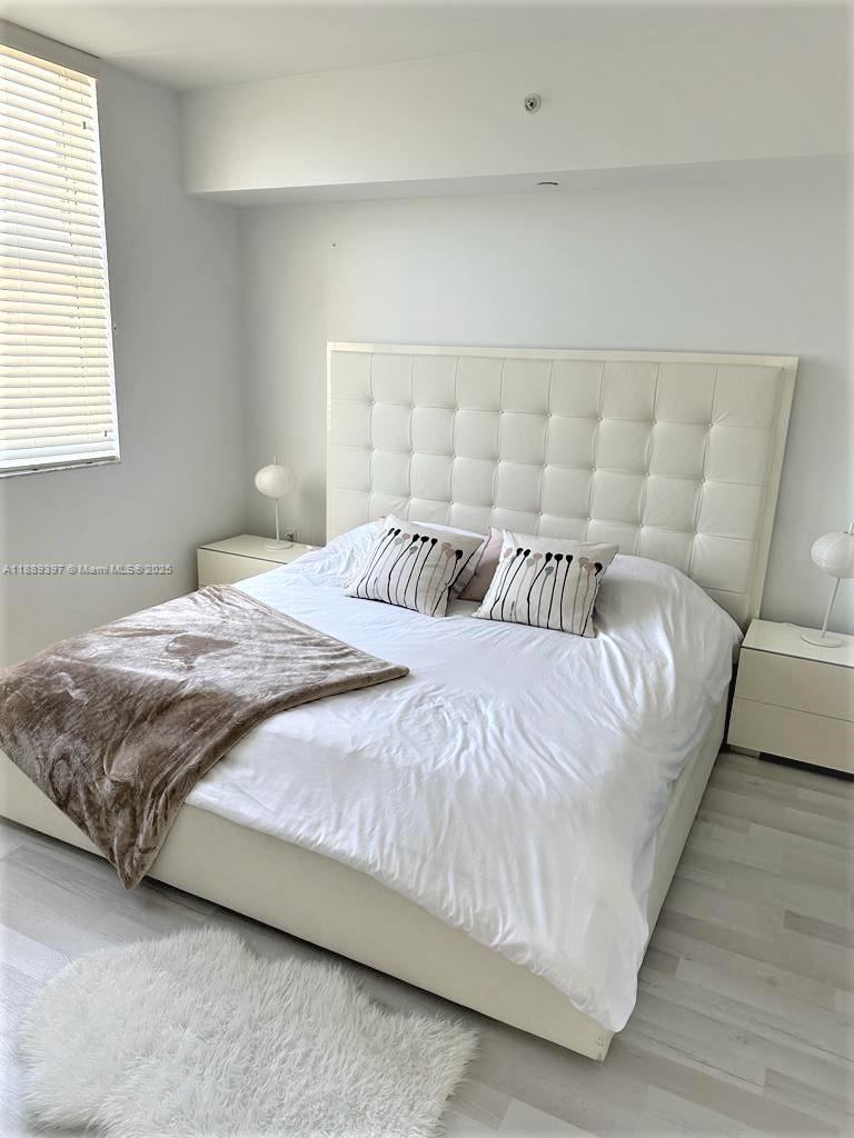 4100 Salzedo Street, Unit 702 Coral Gables, FL 33146 - Photo 14 of 15 a bedroom with a bed and a couch