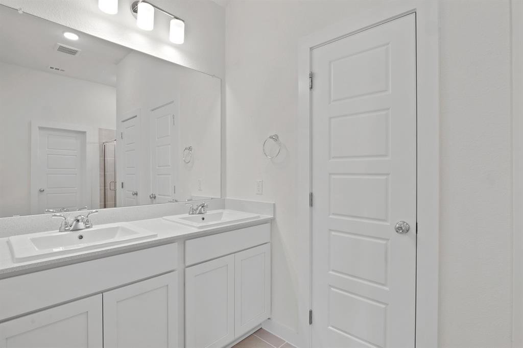 8336 Coastal Lane Pilot Point, TX 76258 - Photo 12 of 17 a bathroom with a sink and a mirror