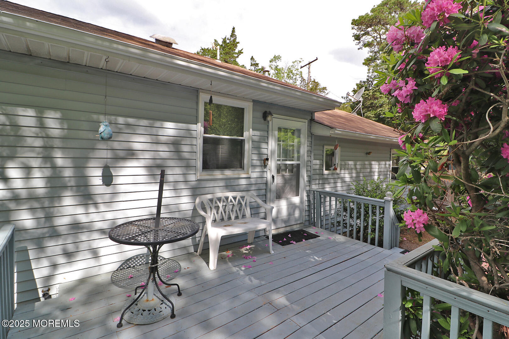 827 Rodgers Street Lanoka Harbor, NJ 08734 - Photo 13 of 33 a view of a chairs and table on the wooden deck