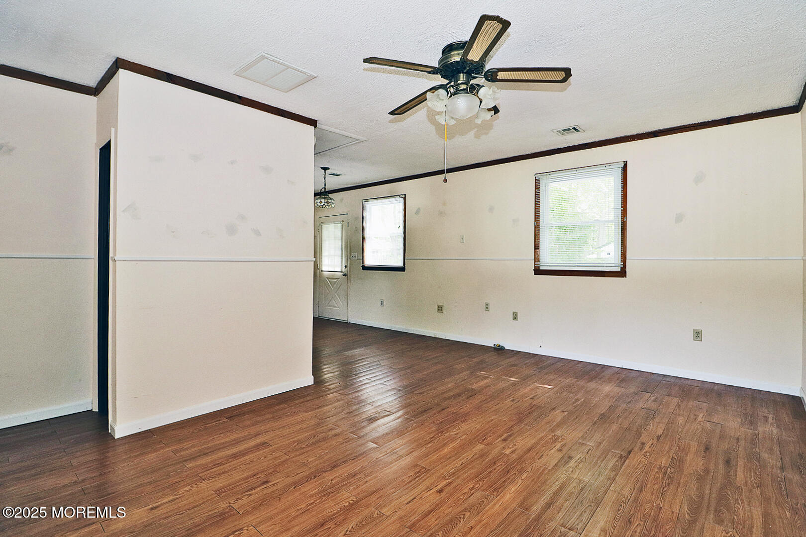 827 Rodgers Street Lanoka Harbor, NJ 08734 - Photo 18 of 33 a view of a refrigerator with wooden floor