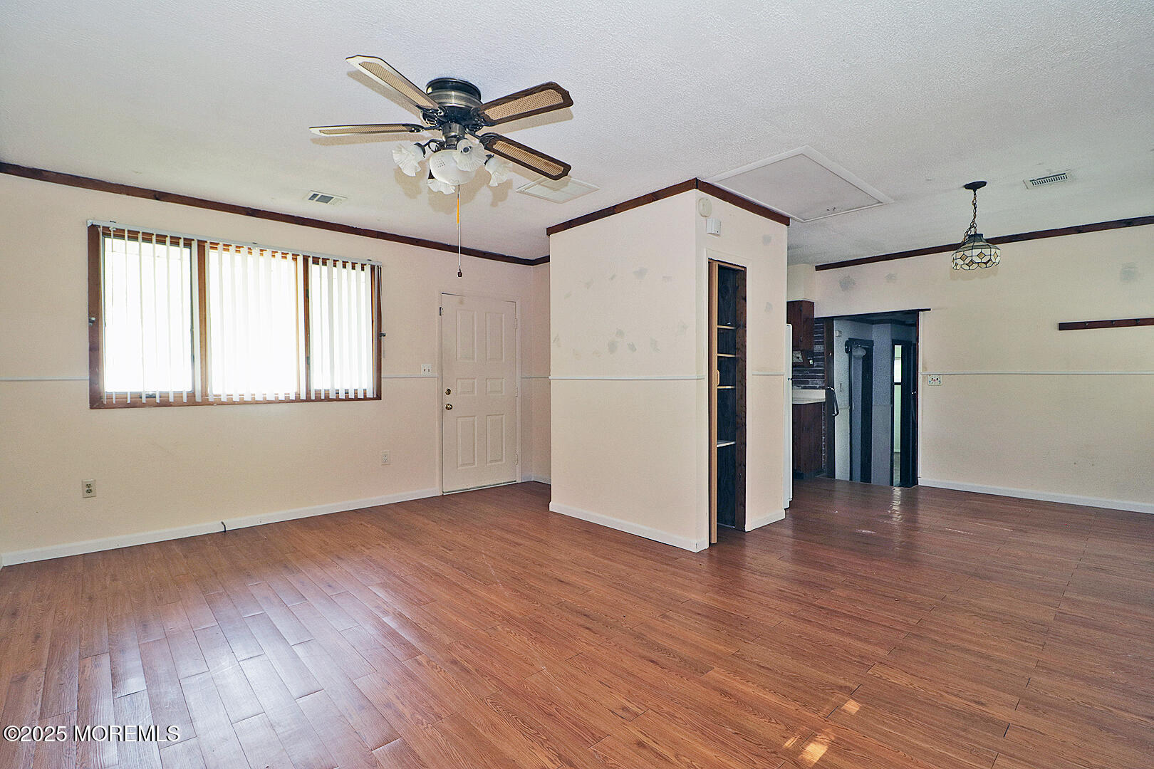 827 Rodgers Street Lanoka Harbor, NJ 08734 - Photo 19 of 33 a view of an empty room with a window and wooden floor