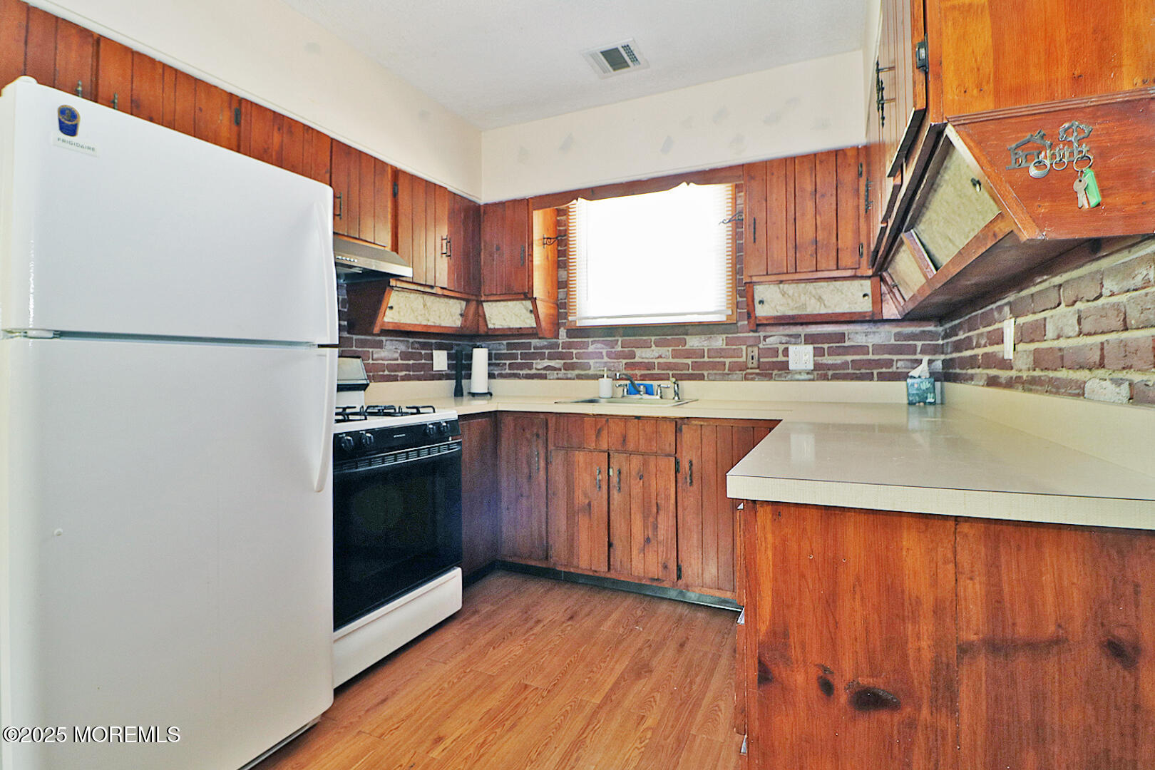 827 Rodgers Street Lanoka Harbor, NJ 08734 - Photo 21 of 33 a kitchen with stainless steel appliances granite countertop a refrigerator a sink dishwasher a stove with wooden cabinets