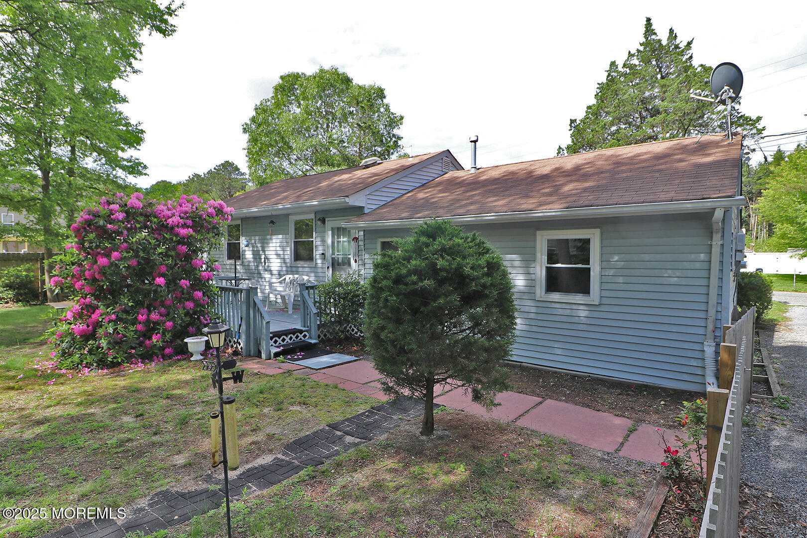 827 Rodgers Street Lanoka Harbor, NJ 08734 - Photo 7 of 33 a front view of a house with a yard