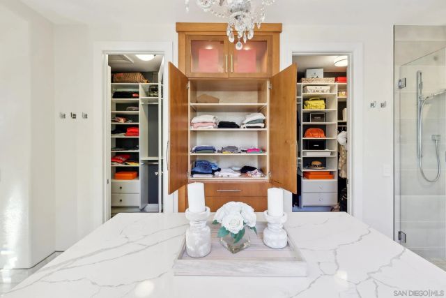 a room with a book shelf and a shelves