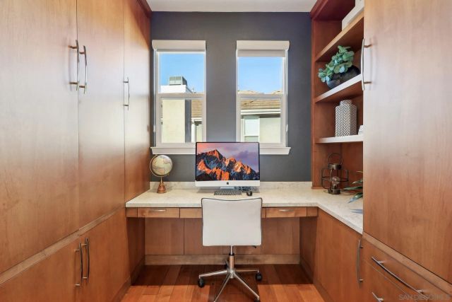 a kitchen with a sink cabinets and window