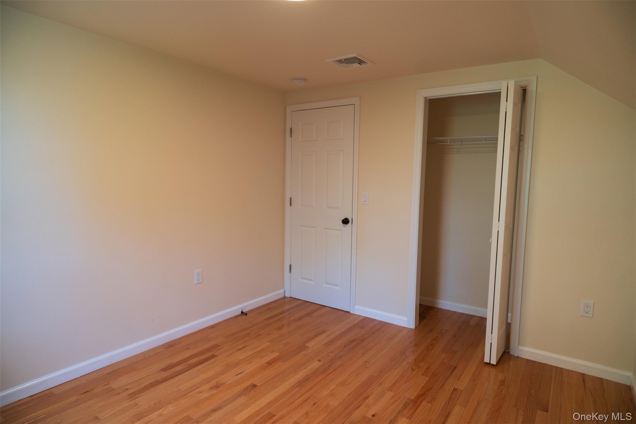 35 Rapalje Road Fishkill, NY 12524 - Photo 25 of 44 a view of an empty room with wooden floor and closet