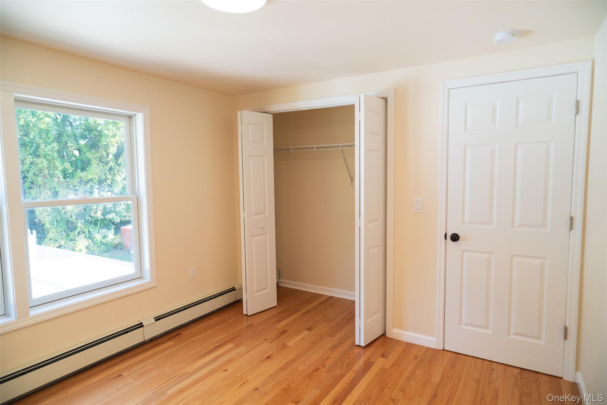35 Rapalje Road Fishkill, NY 12524 - Photo 26 of 44 a view of an empty room with wooden floor and a window
