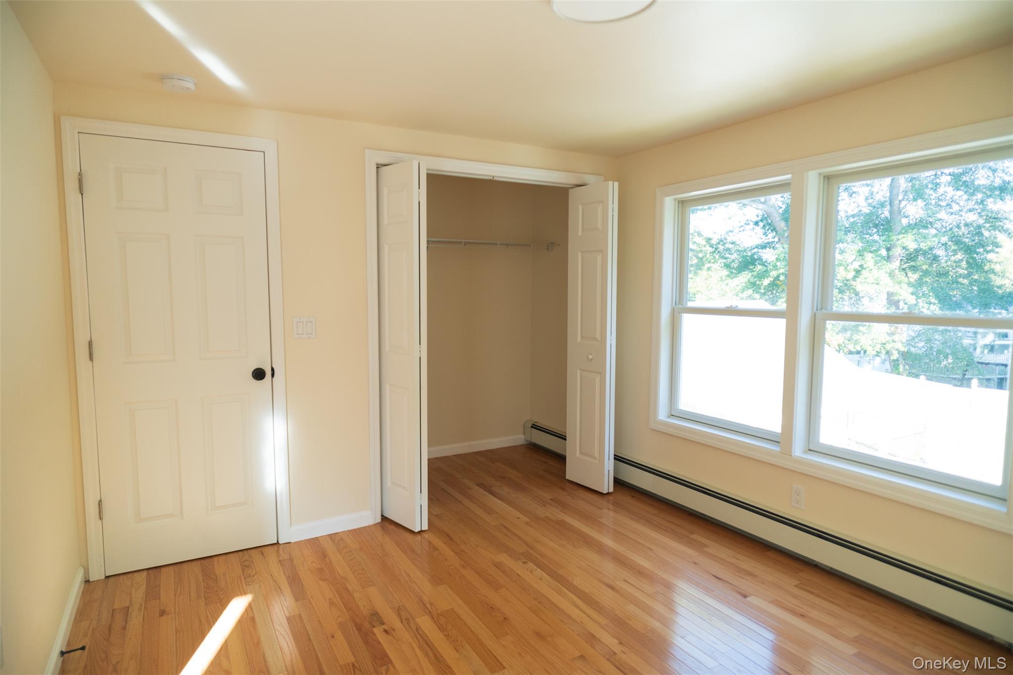 35 Rapalje Road Fishkill, NY 12524 - Photo 28 of 44 an empty room with wooden floor and windows