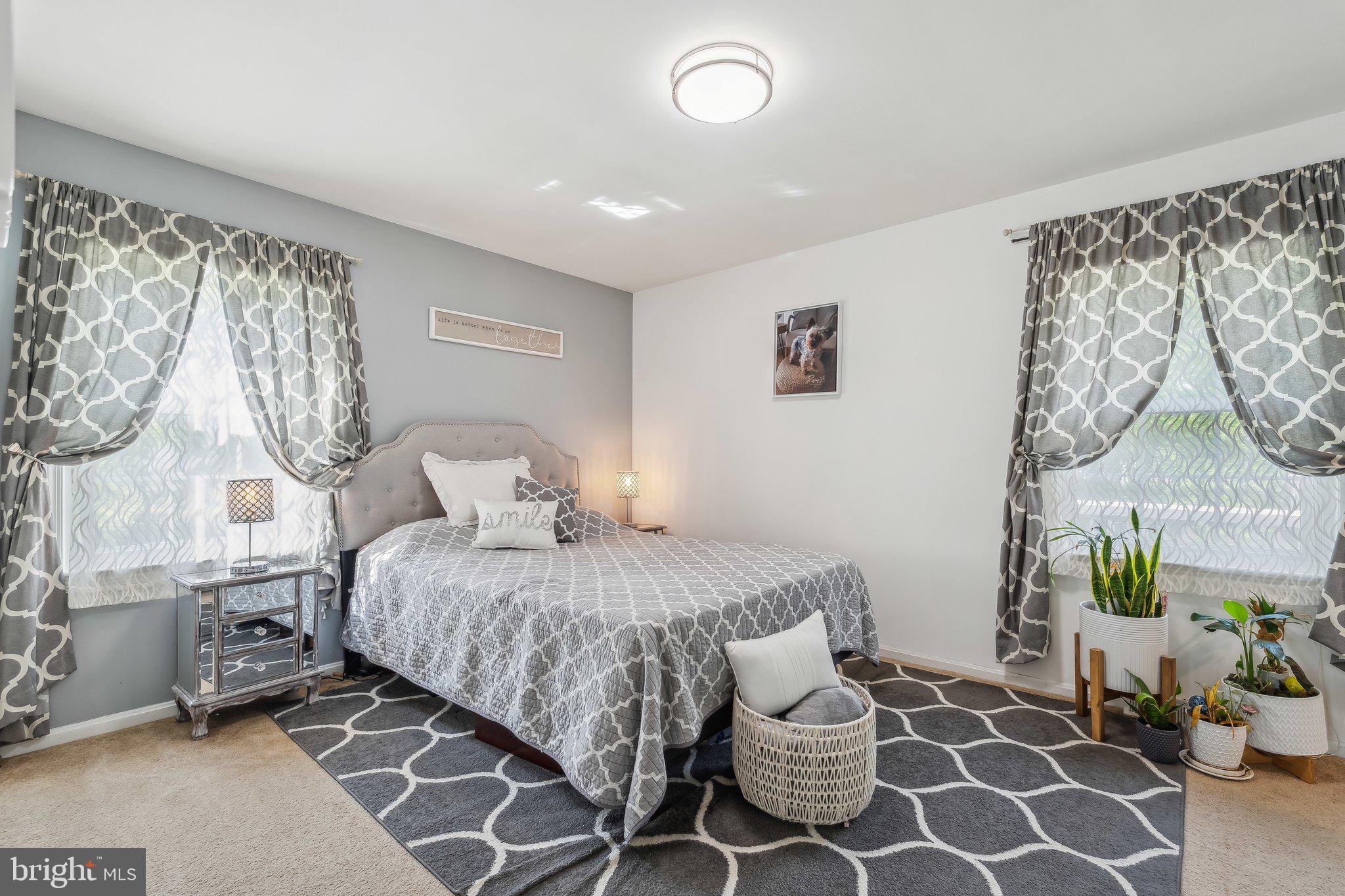 5232 Sumerduck Road Sumerduck, VA 22742 - Photo 11 of 40 a bedroom with a bed and a chandelier