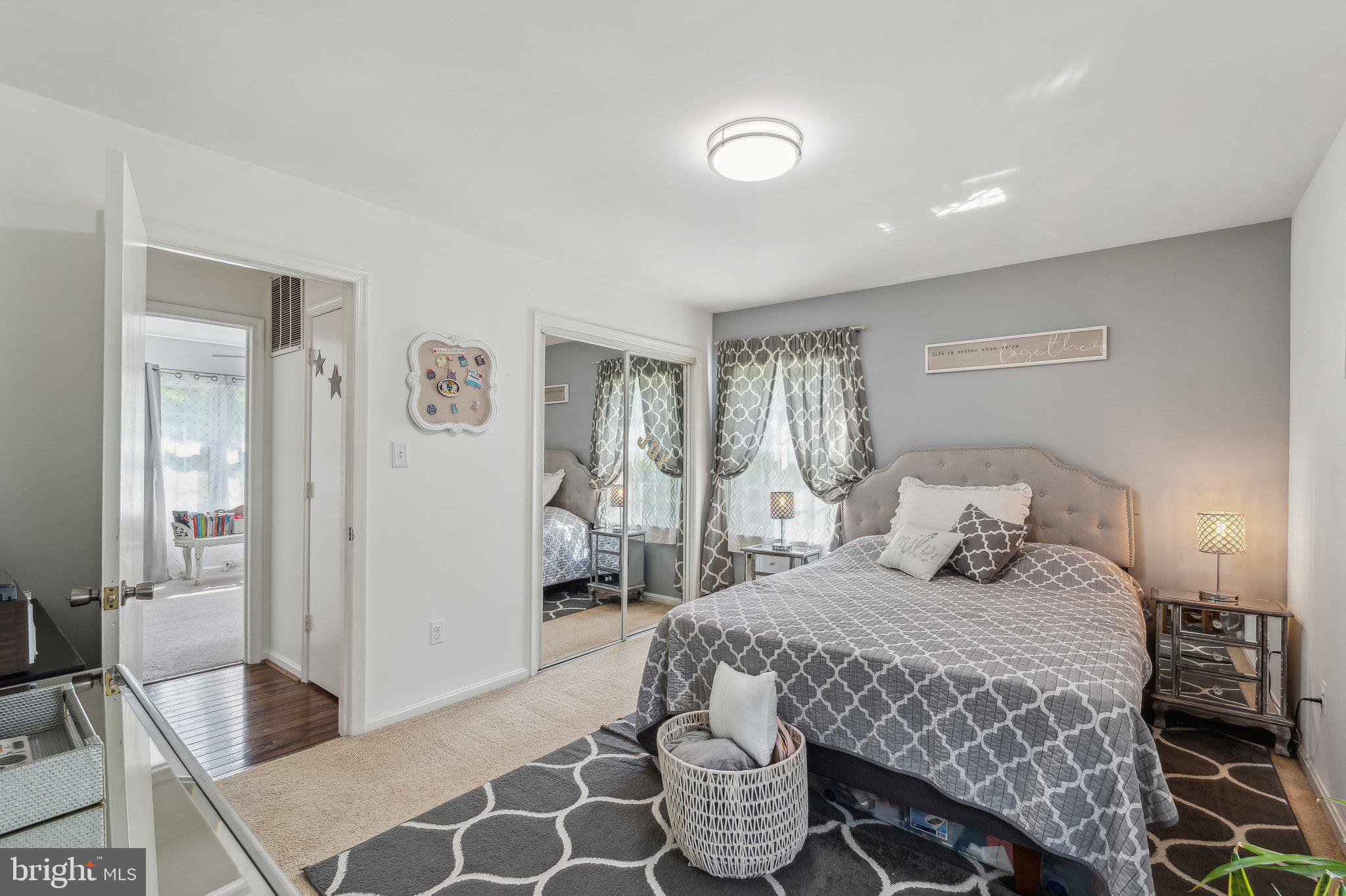 5232 Sumerduck Road Sumerduck, VA 22742 - Photo 12 of 40 a bedroom with a bed and a mirror