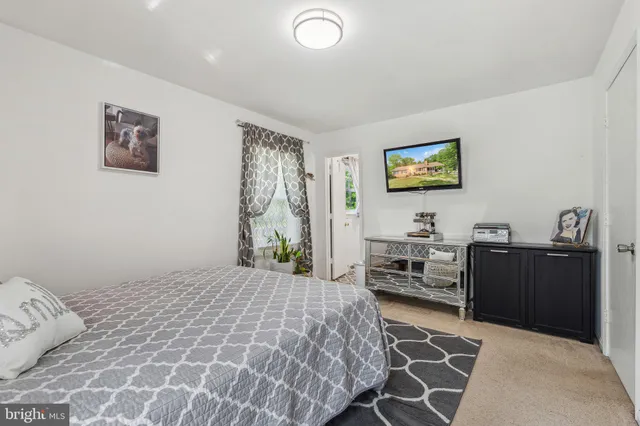 a bedroom with a bed and furniture