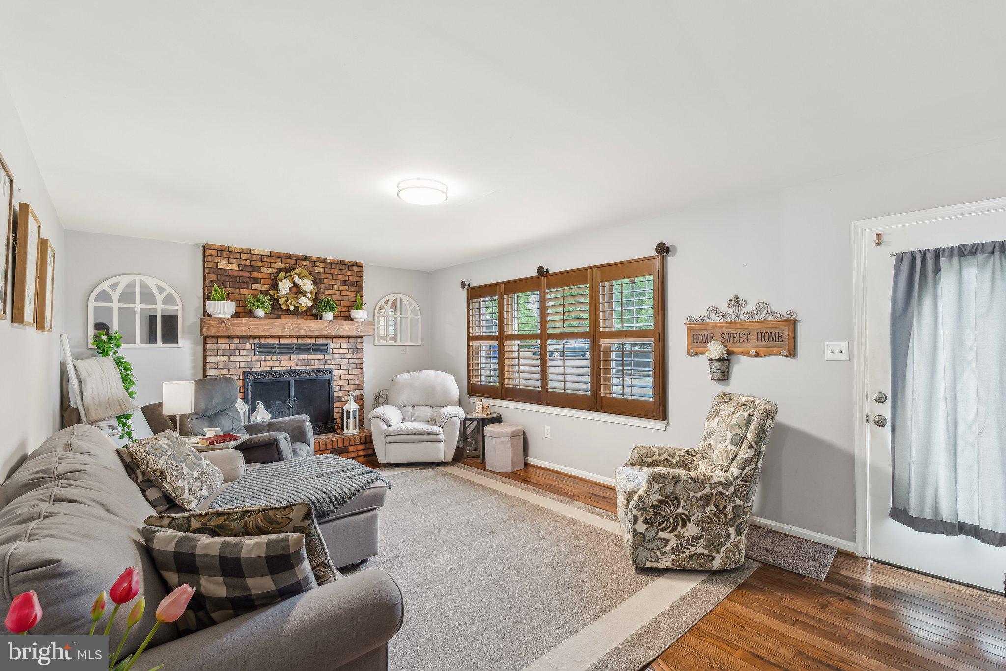 5232 Sumerduck Road Sumerduck, VA 22742 - Photo 29 of 40 a living room with furniture large window and a fireplace