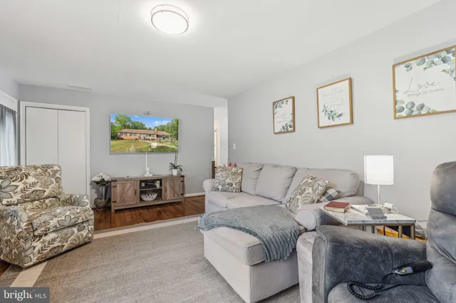 a view of a house with a yard patio and a garden