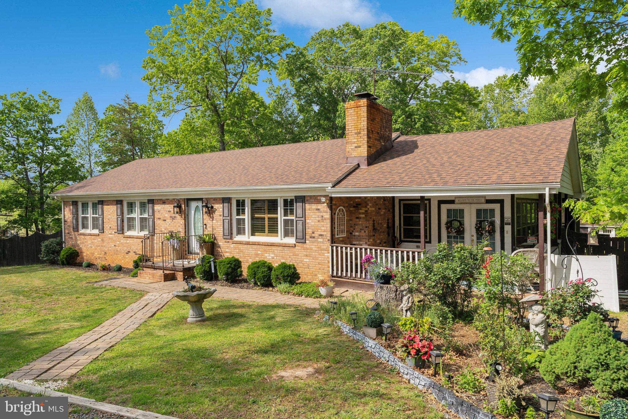 5232 Sumerduck Road Sumerduck, VA 22742 - Photo 31 of 40 a view of a house with a yard patio and a garden