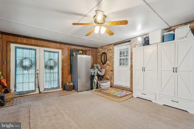 a view of a livingroom with natural light