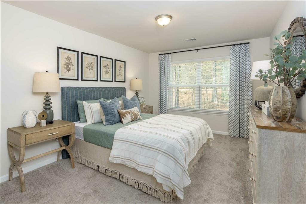 101 Walker Ridge Lane, Unit GINGER Cartersville, GA 30120 - Photo 11 of 40 a bedroom with a bed and a table