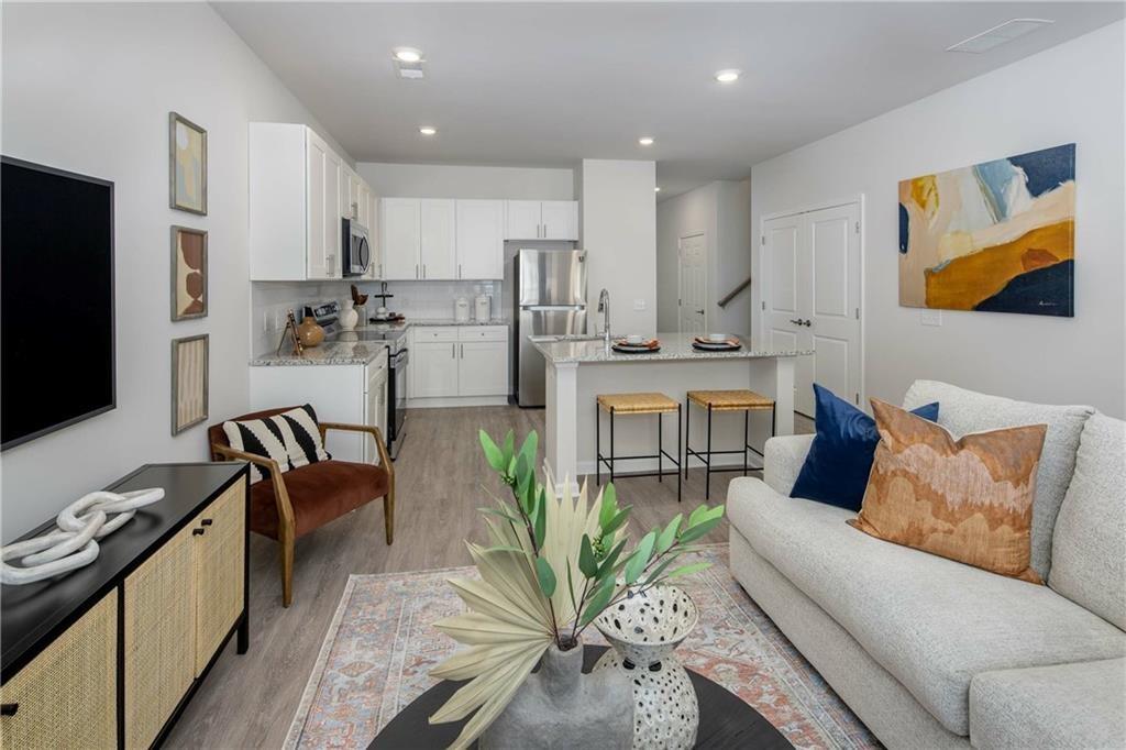 101 Walker Ridge Lane, Unit GINGER Cartersville, GA 30120 - Photo 24 of 40 a living room with stainless steel appliances furniture and a kitchen view