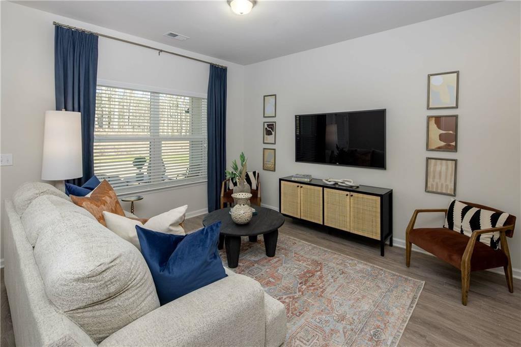 101 Walker Ridge Lane, Unit GINGER Cartersville, GA 30120 - Photo 30 of 40 a living room with furniture and a flat screen tv