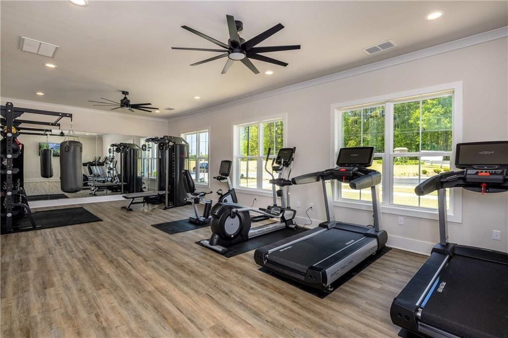 101 Walker Ridge Lane, Unit GINGER Cartersville, GA 30120 - Photo 37 of 40 a living room with furniture gym equipment and a large window