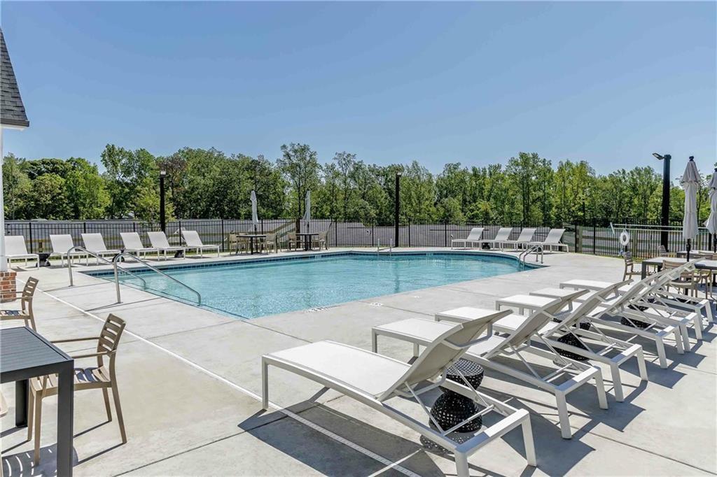 101 Walker Ridge Lane, Unit GINGER Cartersville, GA 30120 - Photo 5 of 40 a view of a swimming pool with outdoor seating and plants
