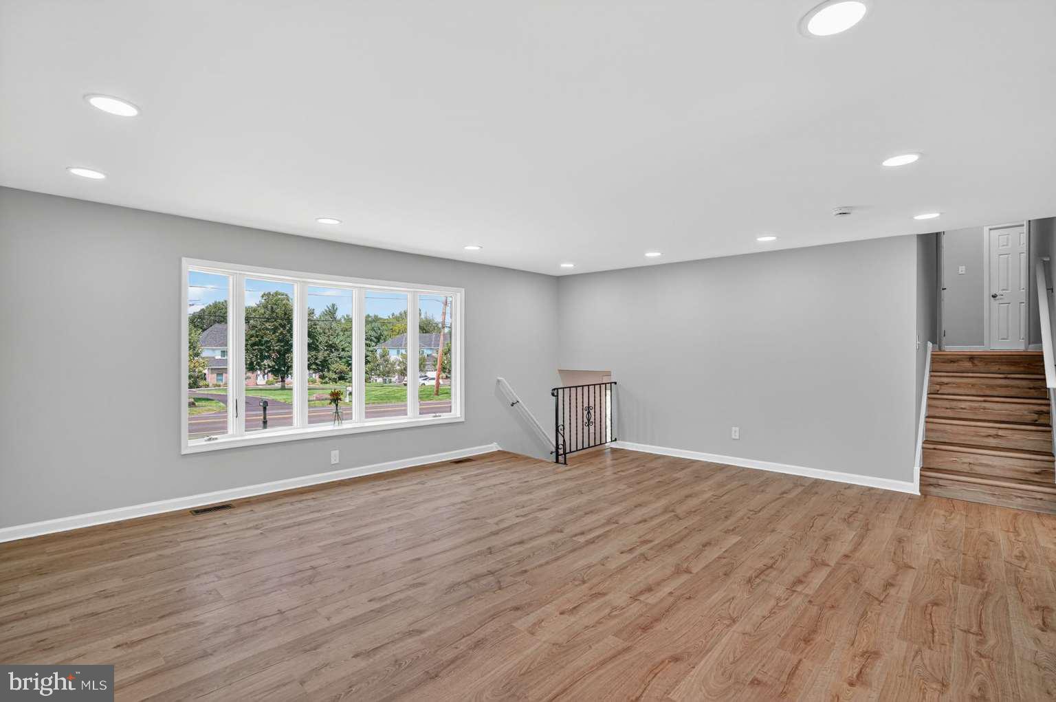 1841 Buck Road Feasterville-Trevose, PA 19053 - Photo 12 of 37 a view of an empty room with wooden floor and a window
