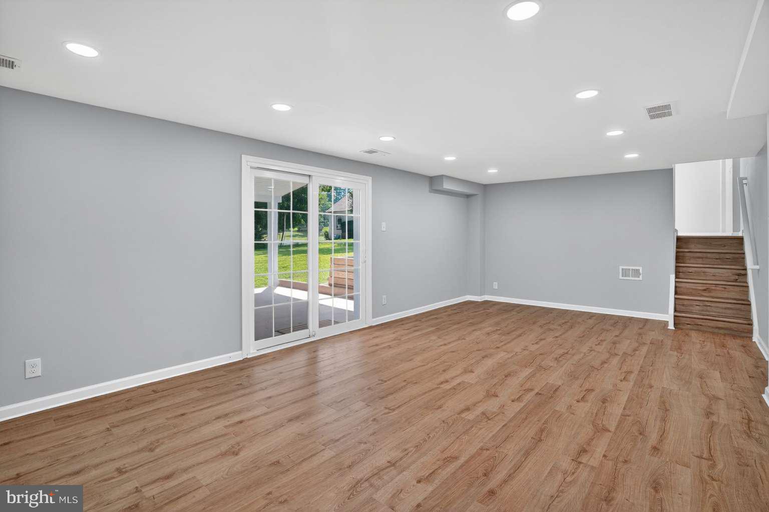 1841 Buck Road Feasterville-Trevose, PA 19053 - Photo 15 of 37 a view of an empty room with wooden floor and a window
