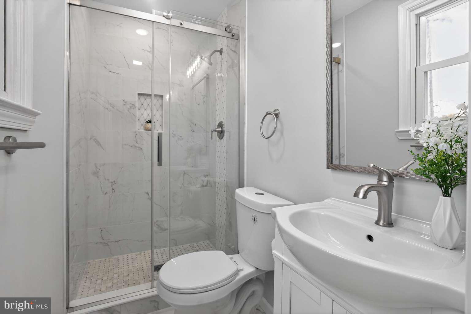 1841 Buck Road Feasterville-Trevose, PA 19053 - Photo 18 of 37 a bathroom with a sink toilet and shower