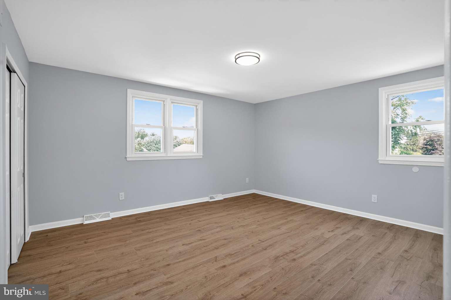 1841 Buck Road Feasterville-Trevose, PA 19053 - Photo 26 of 37 a view of an empty room with wooden floor and a window