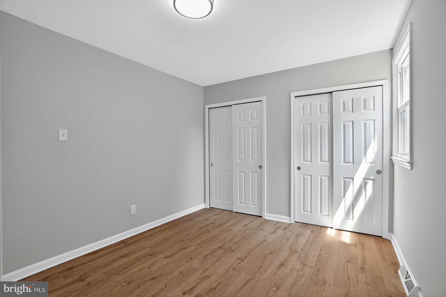 1841 Buck Road Feasterville-Trevose, PA 19053 - Photo 27 of 37 a view of an empty room with wooden floor