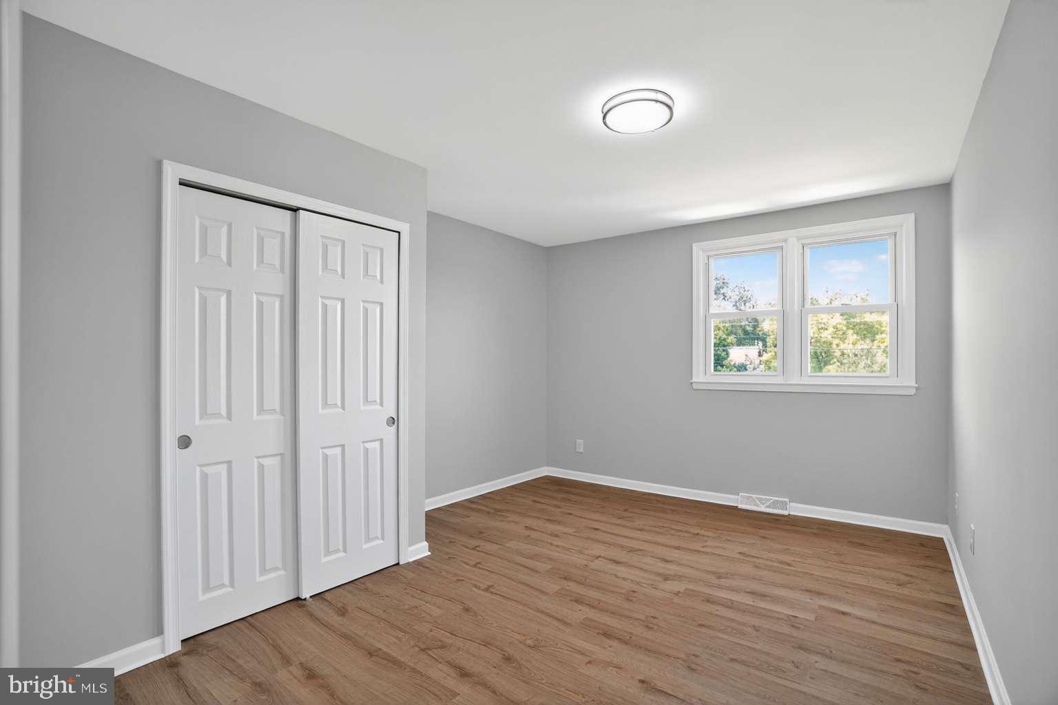 1841 Buck Road Feasterville-Trevose, PA 19053 - Photo 29 of 37 a view of an empty room with wooden floor and a window