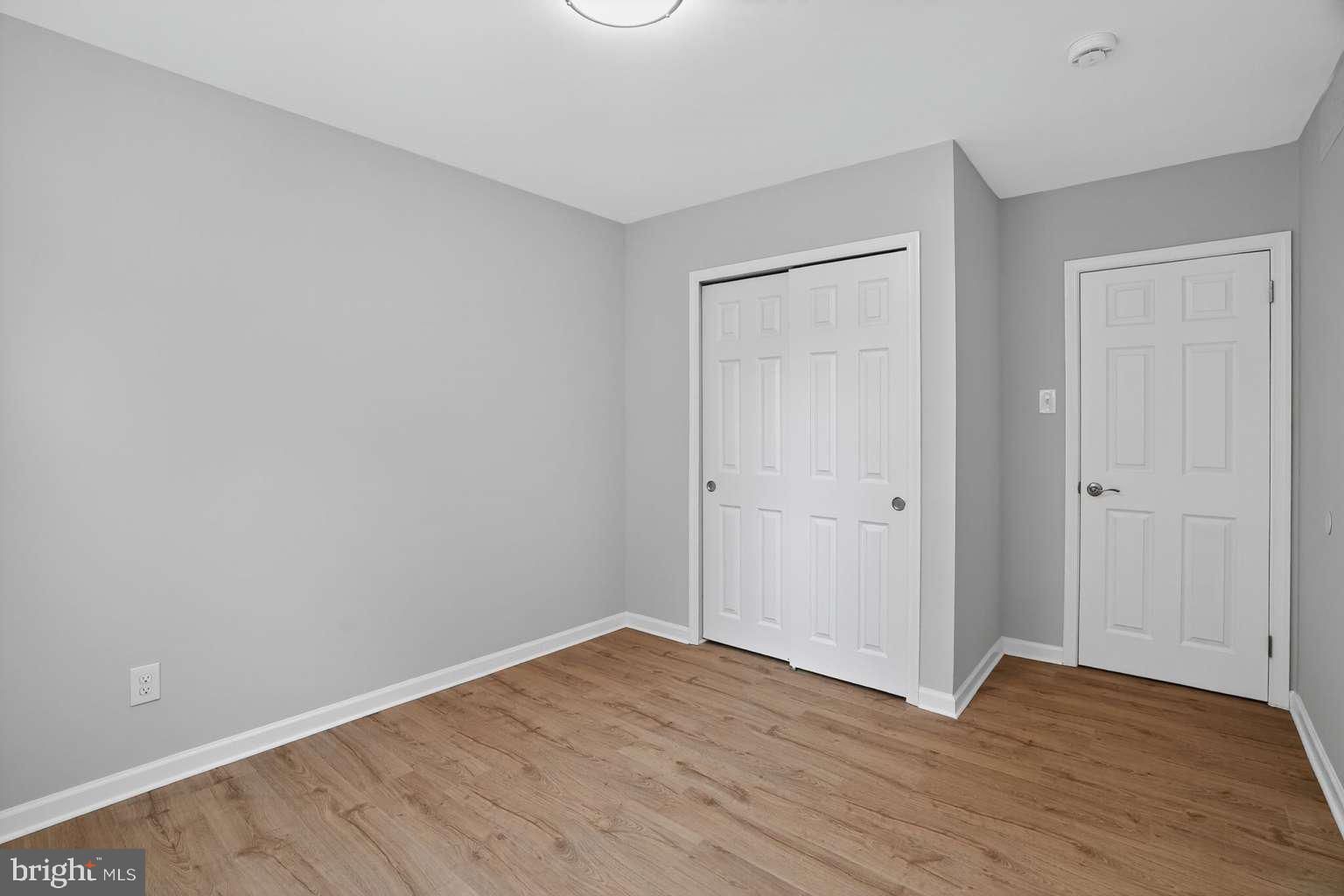 1841 Buck Road Feasterville-Trevose, PA 19053 - Photo 30 of 37 a view of an empty room with wooden floor and closet