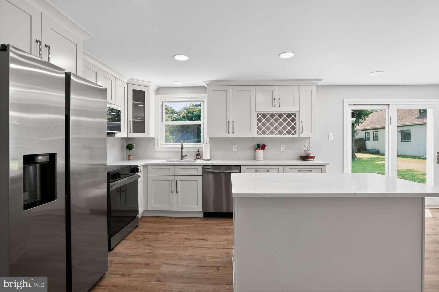 1841 Buck Road Feasterville-Trevose, PA 19053 - Photo 6 of 37 a kitchen with stainless steel appliances a refrigerator sink and stove