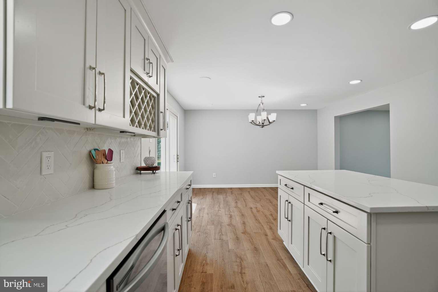 1841 Buck Road Feasterville-Trevose, PA 19053 - Photo 8 of 37 a kitchen with cabinets and wooden floor