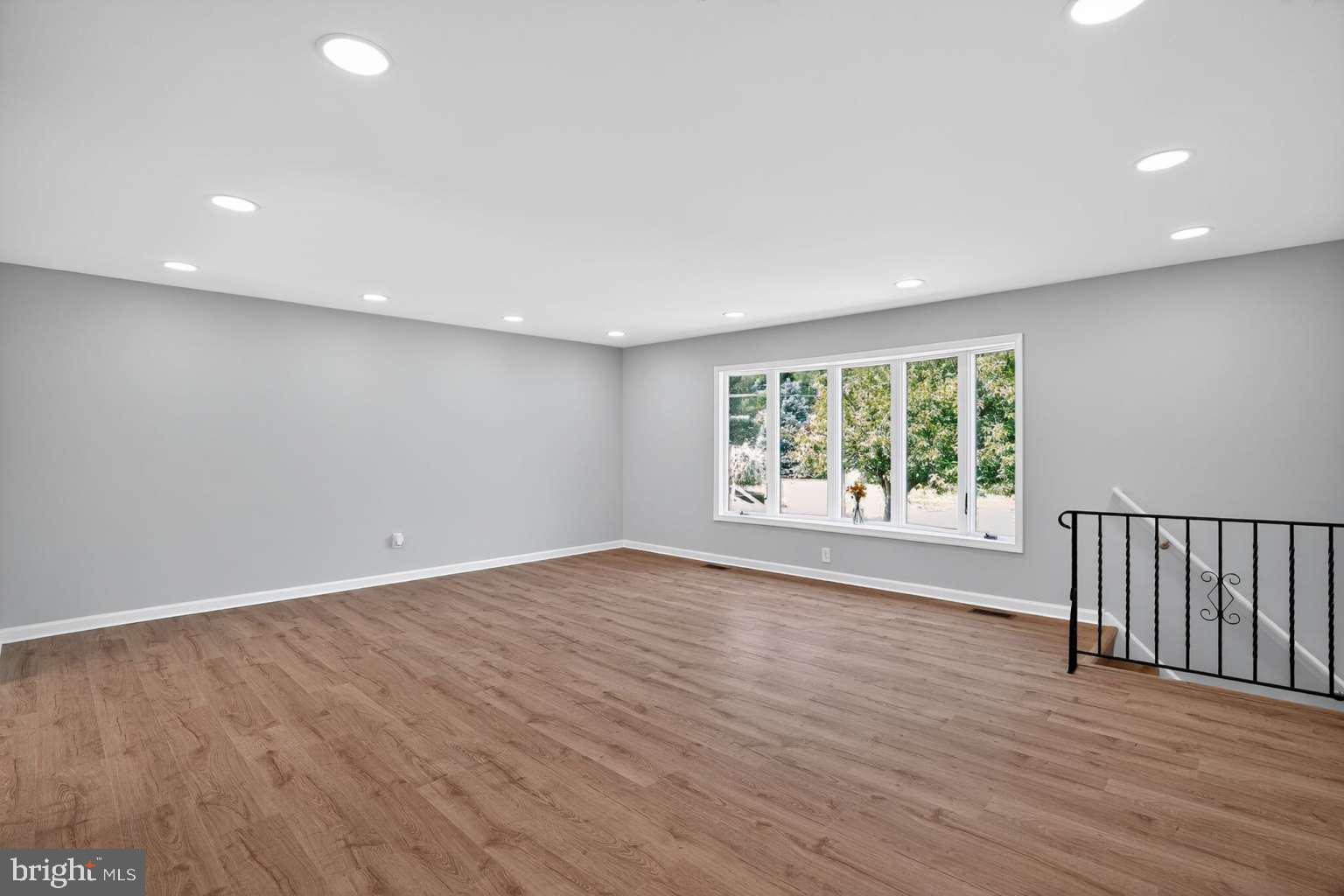1841 Buck Road Feasterville-Trevose, PA 19053 - Photo 10 of 37 a view of an empty room with wooden floor and a window