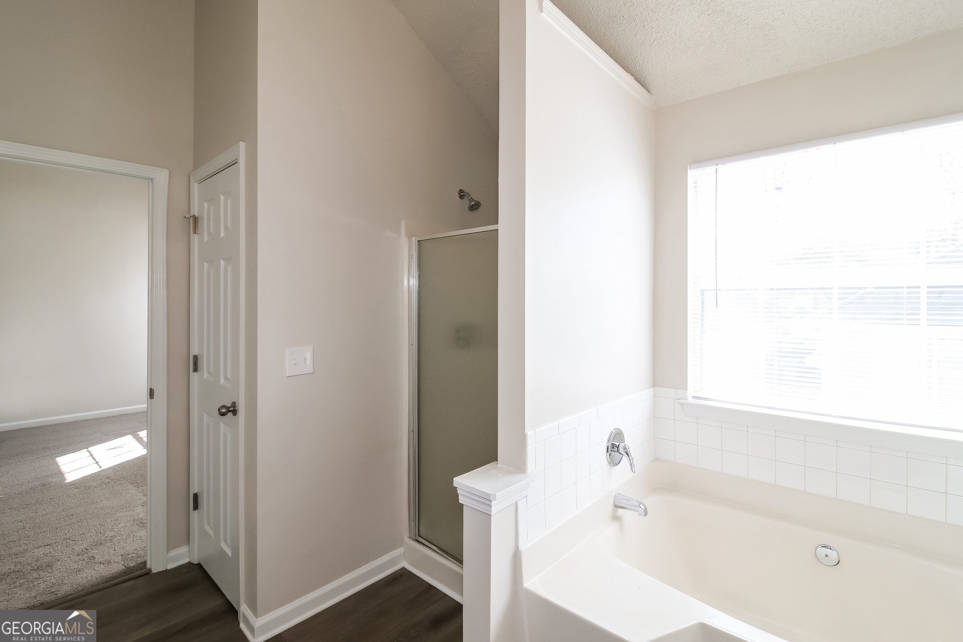 165 Colser Drive Covington, GA 30016 - Photo 11 of 17 a white bath tub sitting next to a white sink