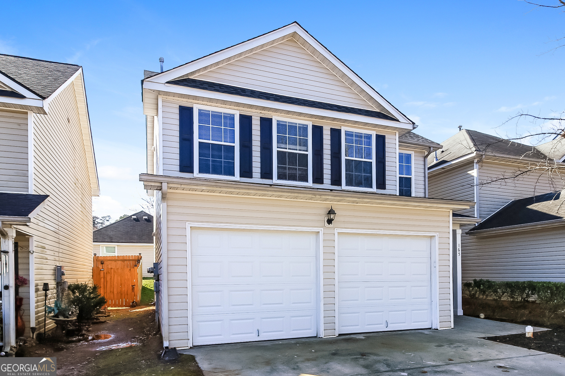 165 Colser Drive Covington, GA 30016 - Photo 3 of 17 a view of a house with garage