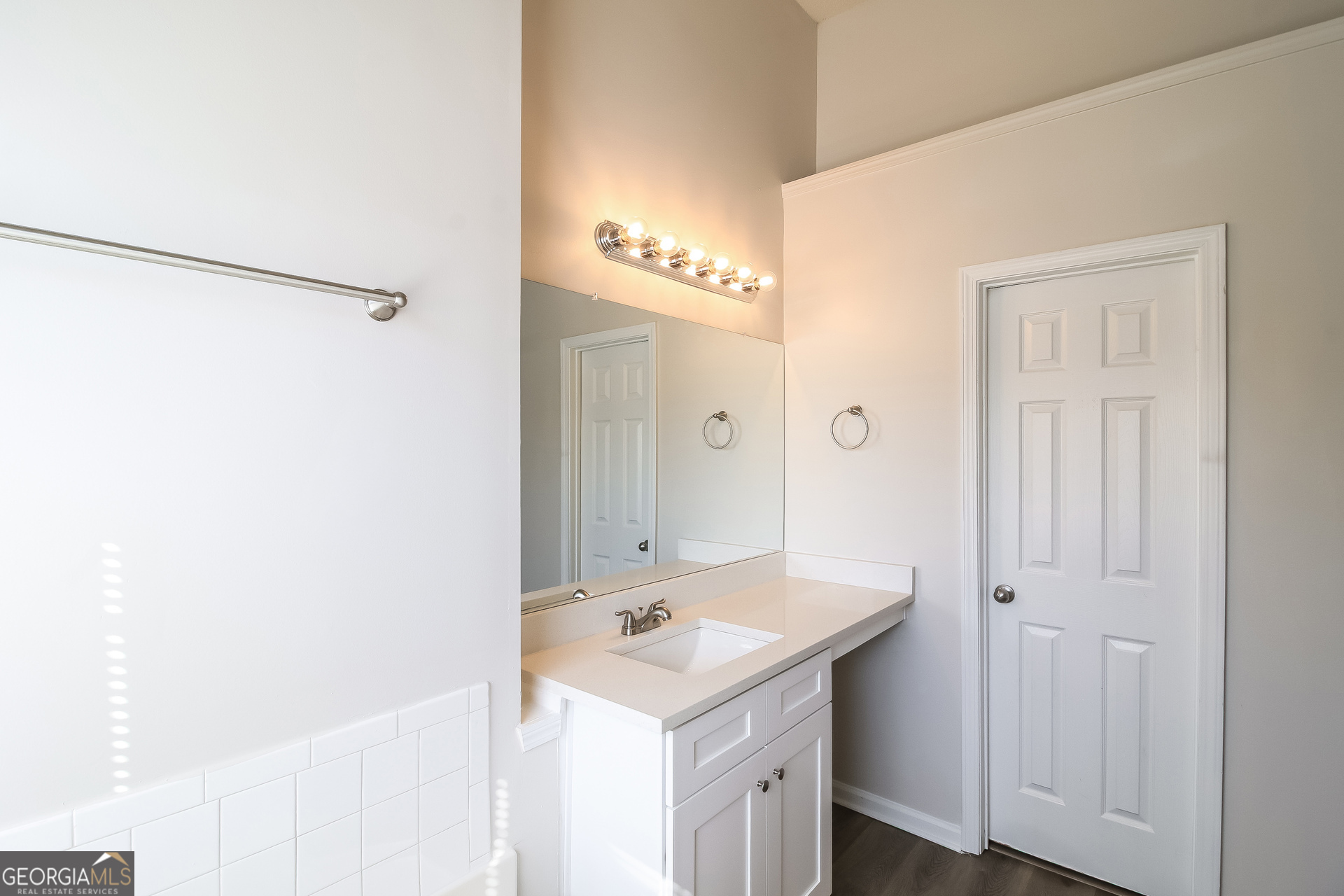 165 Colser Drive Covington, GA 30016 - Photo 10 of 17 a bathroom with a sink and a mirror
