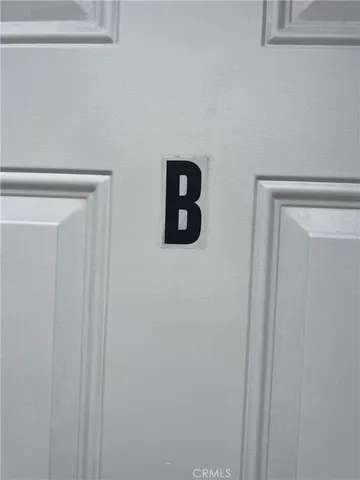 a white wall under a mirror