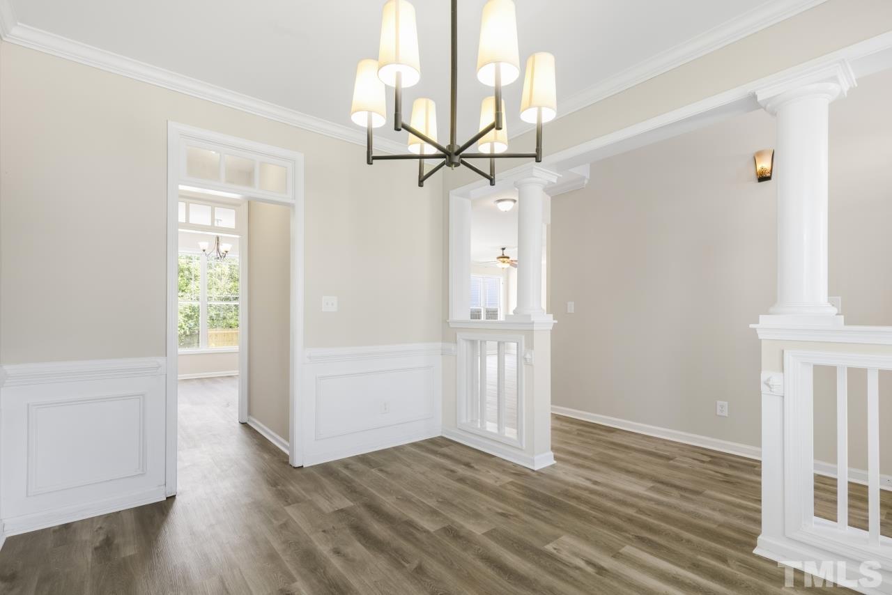 4029 Patriot Ridge Court Raleigh, NC 27610 - Photo 5 of 35 an empty room and wooden floor chandelier fan