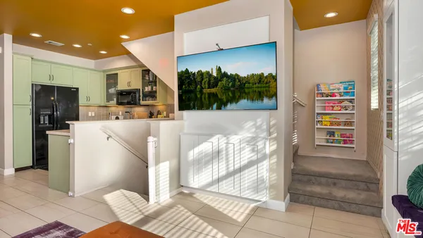 a kitchen with a sink cabinets and microwave