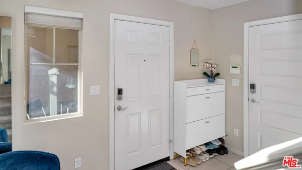 a view of room with window and wooden floor