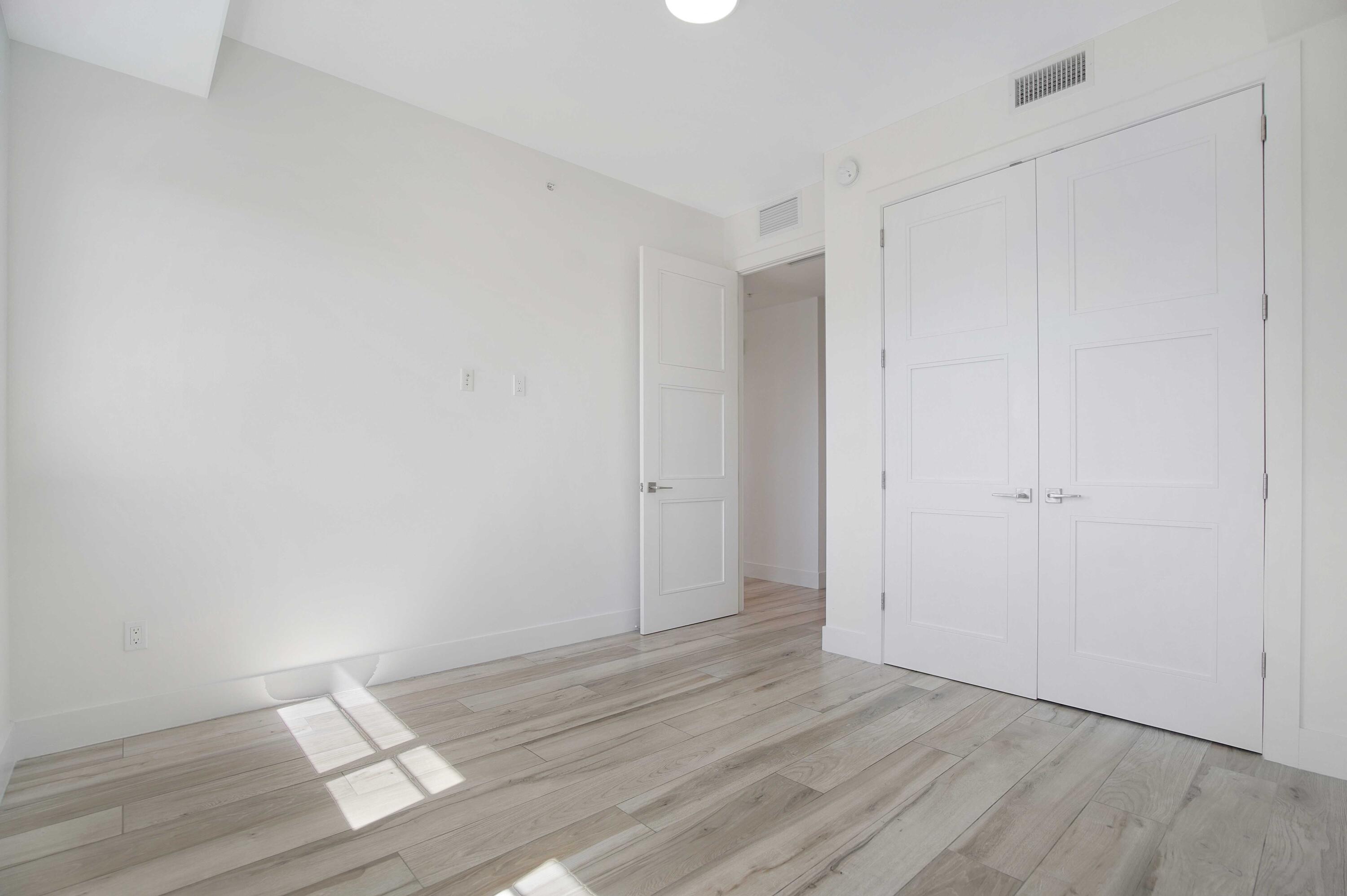 155 East Boca Raton Road, Unit 822 Boca Raton, FL 33432 - Photo 19 of 73 a view of an empty room and wooden floor
