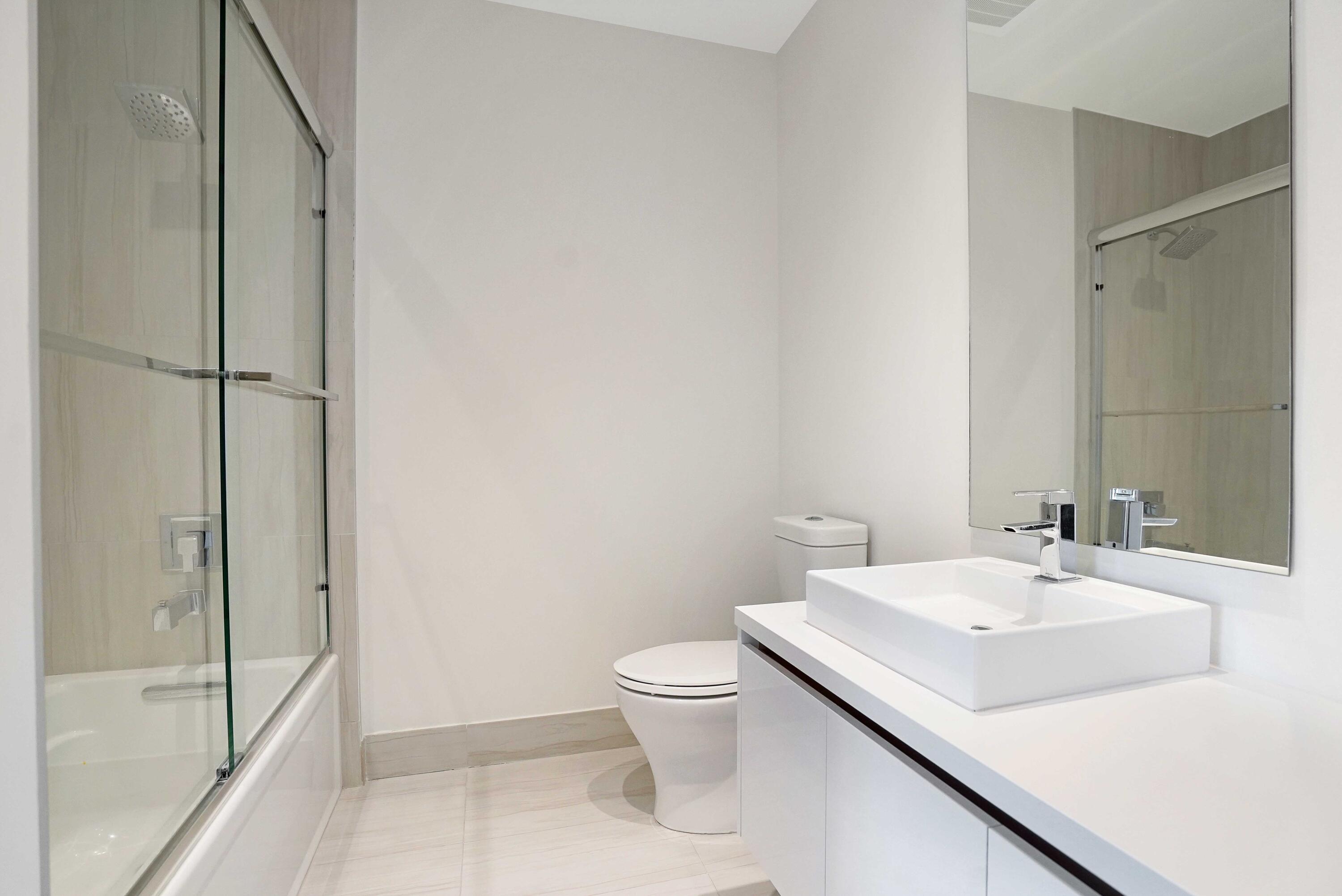 155 East Boca Raton Road, Unit 822 Boca Raton, FL 33432 - Photo 22 of 73 a bathroom with a sink toilet and shower