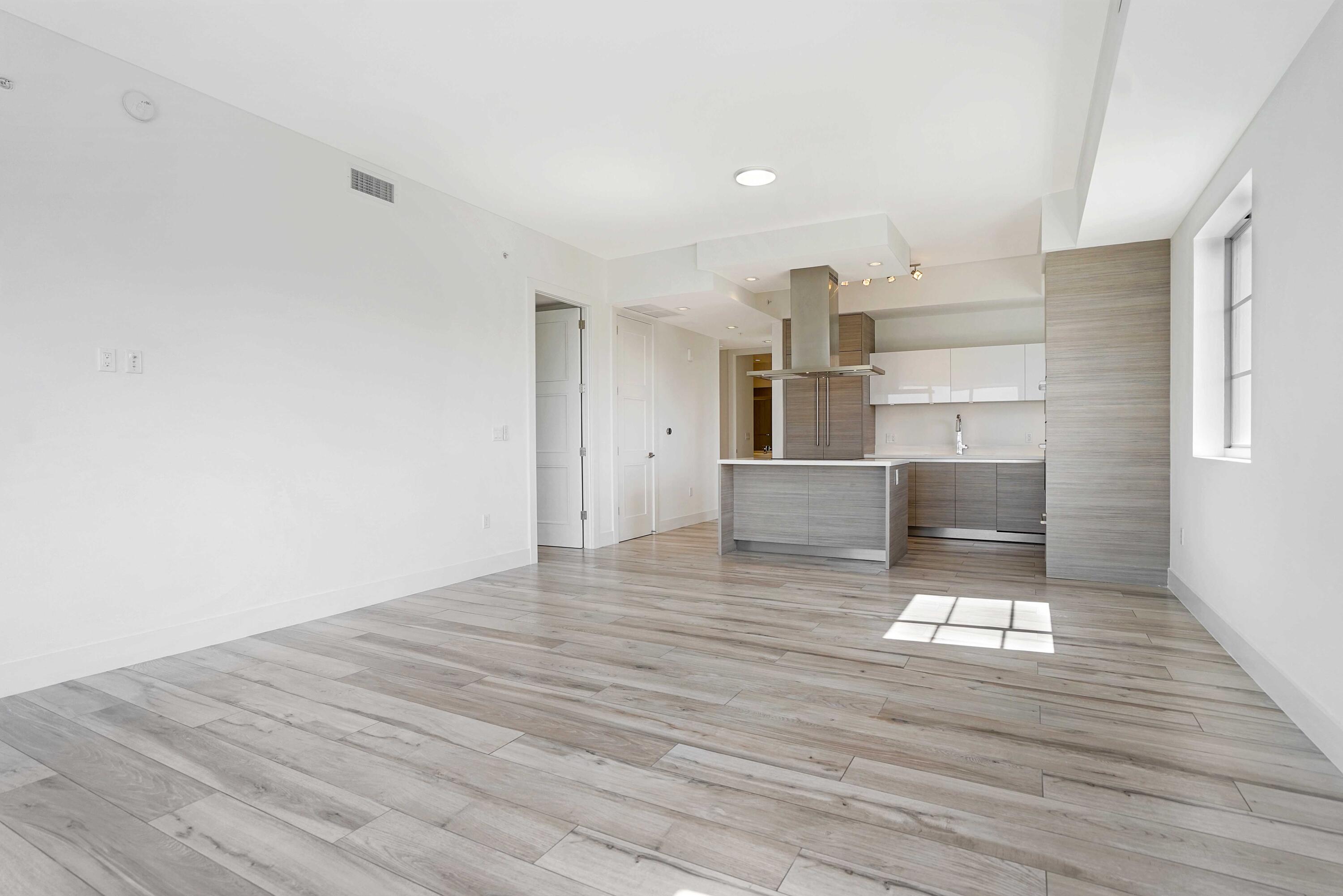 155 East Boca Raton Road, Unit 822 Boca Raton, FL 33432 - Photo 25 of 73 a view of a kitchen with wooden floor and electronic appliances