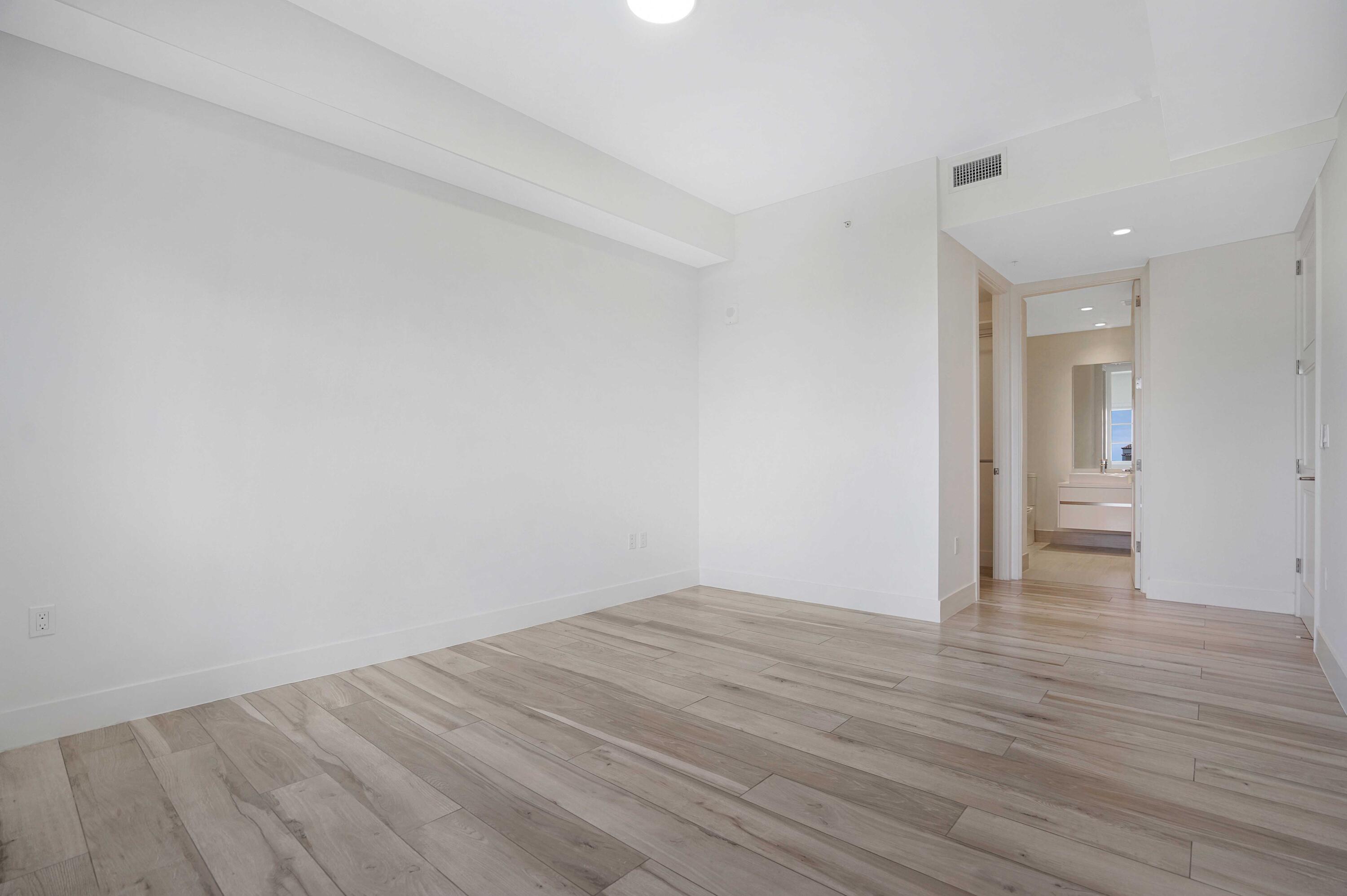 155 East Boca Raton Road, Unit 822 Boca Raton, FL 33432 - Photo 30 of 73 a view of an empty room and wooden floor